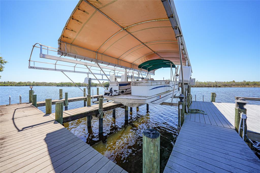 8635 Southwest Riverside Drive Arcadia, FL 34269 - Photo 55 of 70 a view of a balcony with chairs and wooden floor