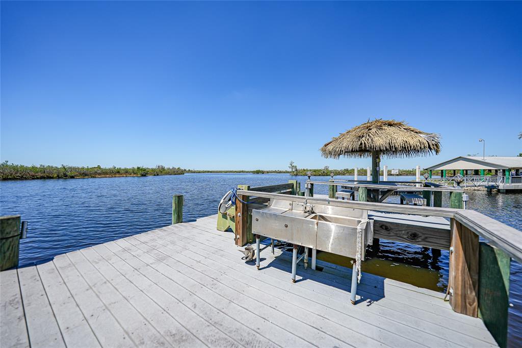 8635 Southwest Riverside Drive Arcadia, FL 34269 - Photo 57 of 70 a view of a terrace with seating area and barbeque oven