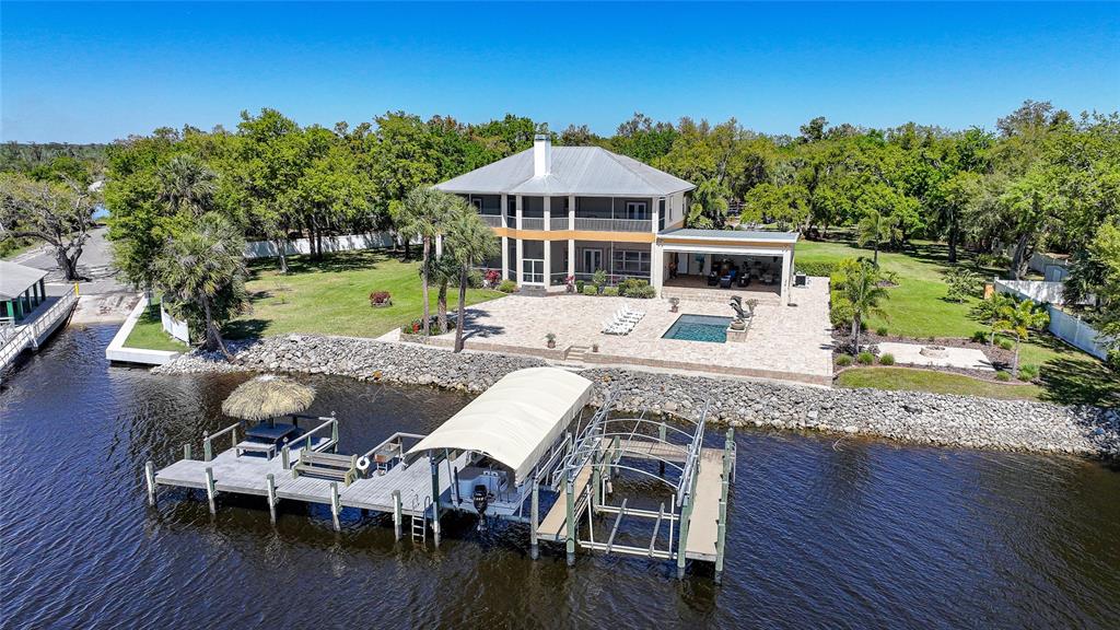 8635 Southwest Riverside Drive Arcadia, FL 34269 - Photo 61 of 70 a view of a house with swimming pool and sitting area
