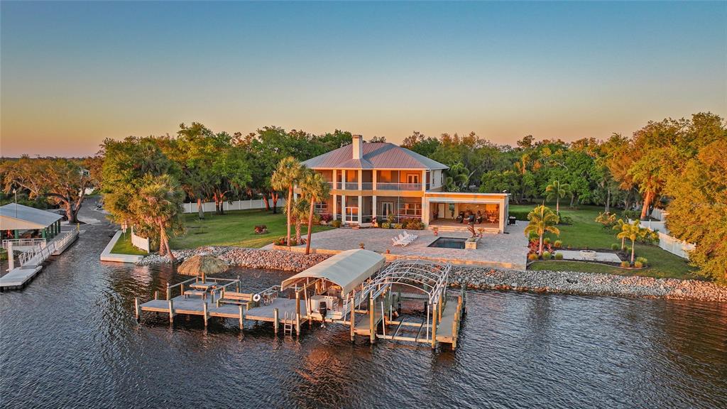 8635 Southwest Riverside Drive Arcadia, FL 34269 - Photo 65 of 70 a view of a house with pool porch and chairs