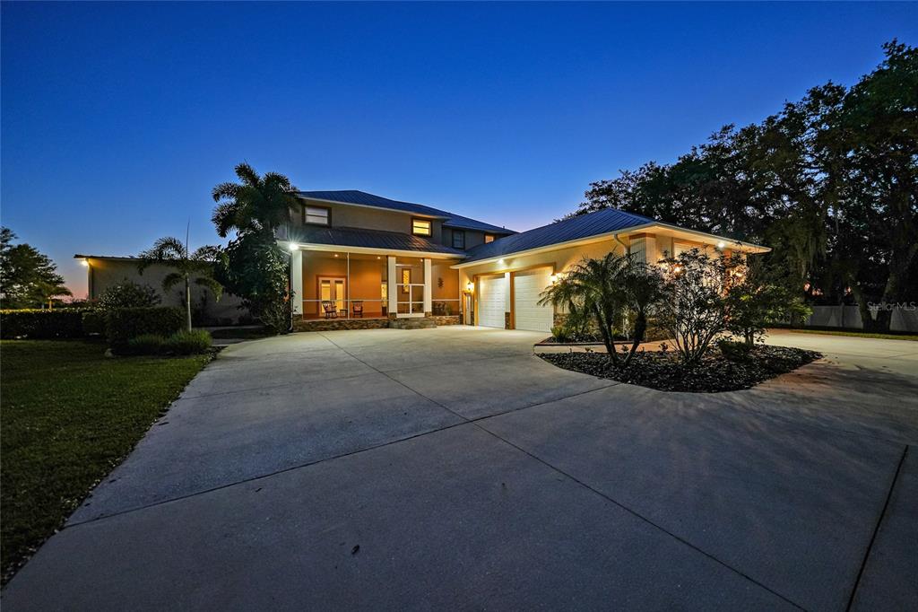 8635 Southwest Riverside Drive Arcadia, FL 34269 - Photo 67 of 70 a front view of a house with a yard