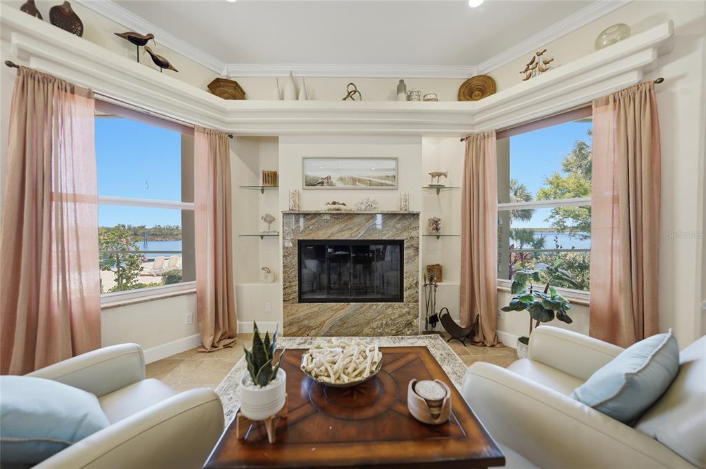 8635 Southwest Riverside Drive Arcadia, FL 34269 - Photo 7 of 70 a living room with furniture and a fireplace