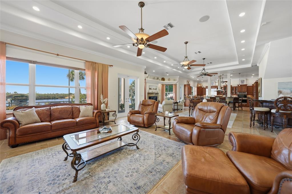 8635 Southwest Riverside Drive Arcadia, FL 34269 - Photo 10 of 70 a living room with furniture ceiling fan and a rug
