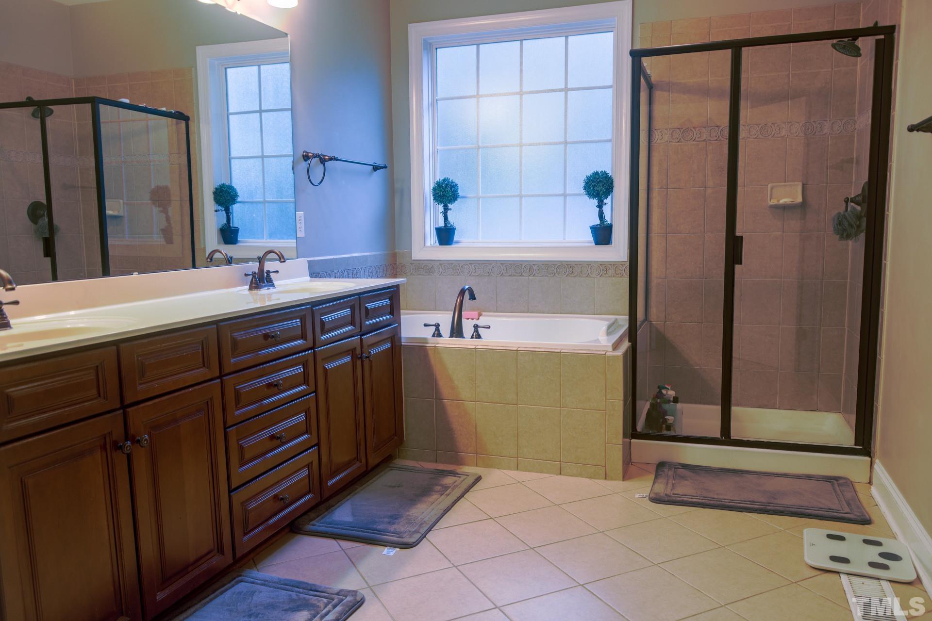 10100 Darling Street Raleigh, NC 27613 - Photo 13 of 24 a room with a cabinets and a sink