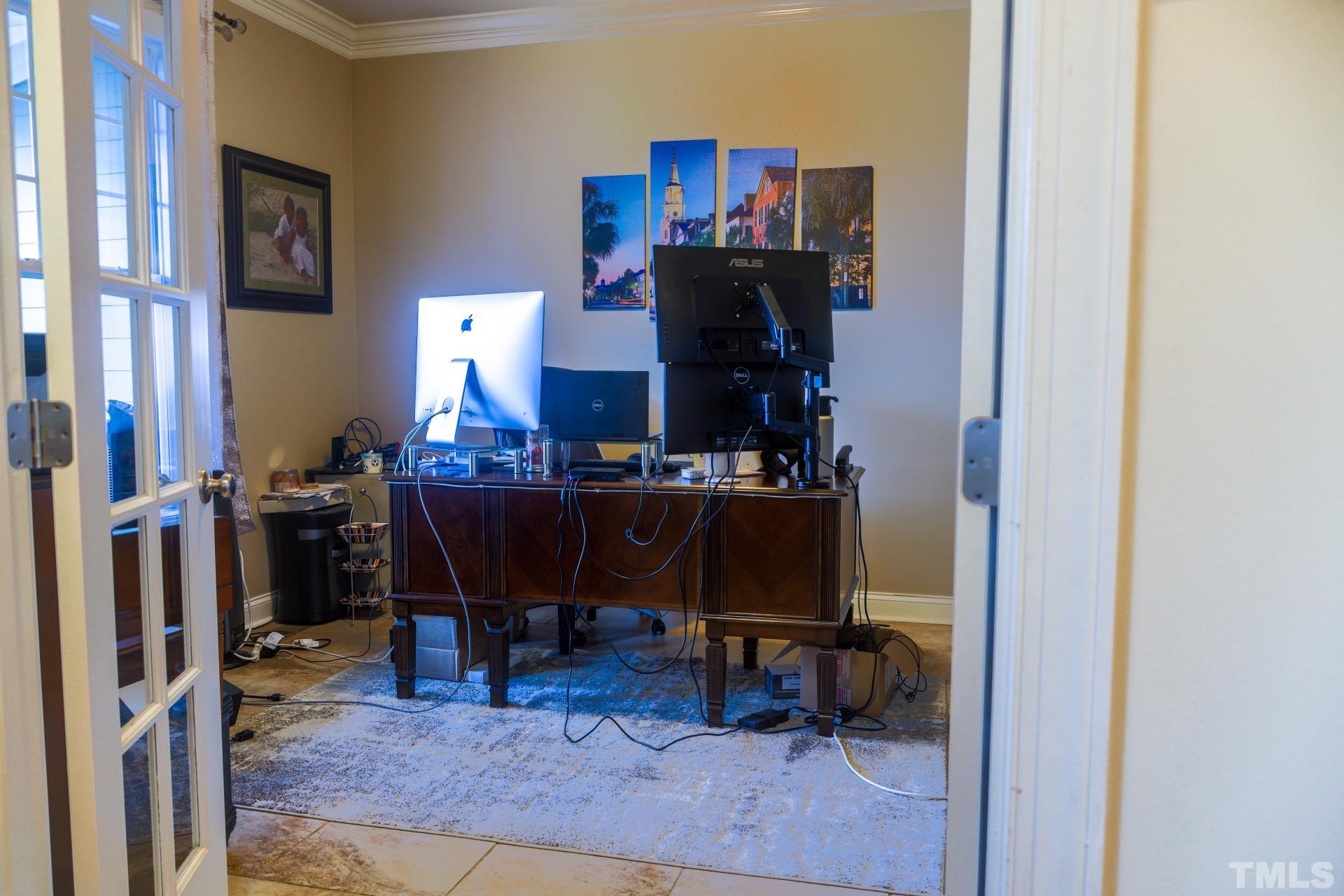 10100 Darling Street Raleigh, NC 27613 - Photo 17 of 24 a view of a workspace with furniture