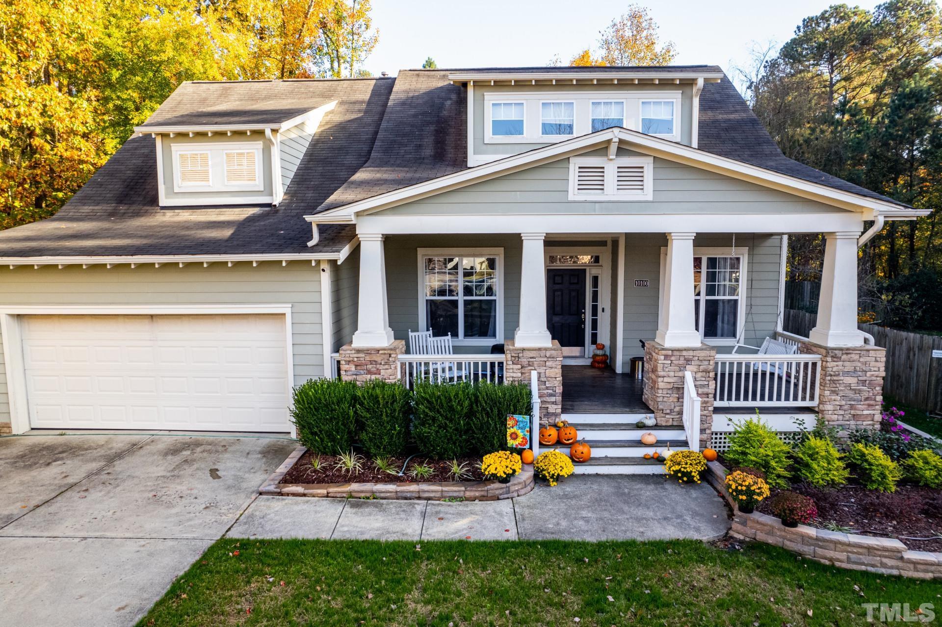 10100 Darling Street Raleigh, NC 27613 - Photo 2 of 24 a front view of a house with garden and porch