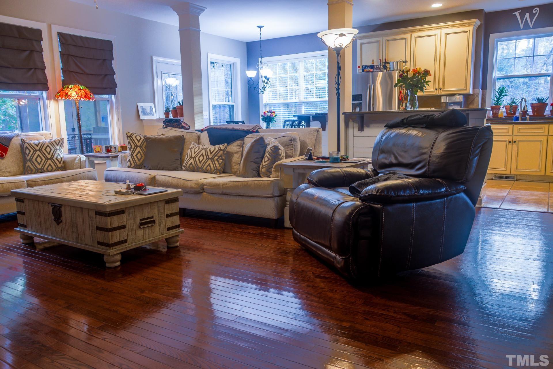 10100 Darling Street Raleigh, NC 27613 - Photo 9 of 24 a living room with furniture and wooden floor