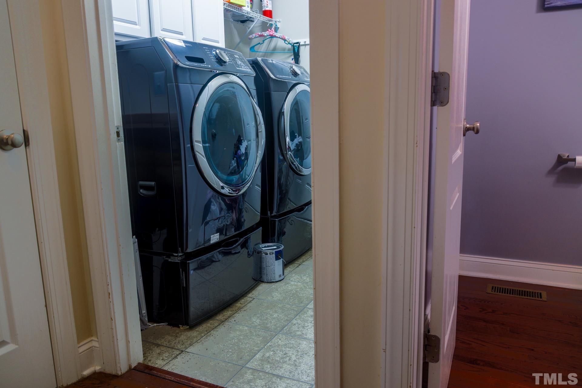 10100 Darling Street Raleigh, NC 27613 - Photo 10 of 24 a view of storage and utility room with washer and dryer