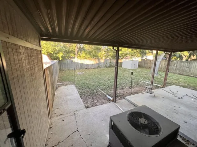 a view of a two chairs in the balcony