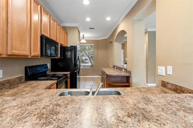 a kitchen with a sink and a window