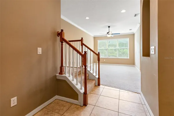 a view of a livingroom with furniture and floor to ceiling window