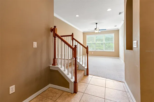 a view of a livingroom with furniture and floor to ceiling window