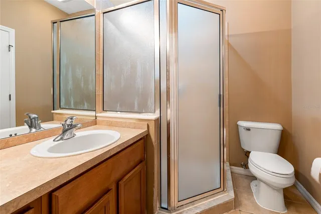 an aerial view of multiple houses with a yard