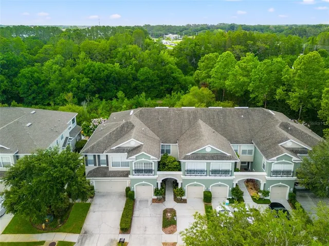 an aerial view of house with a garden