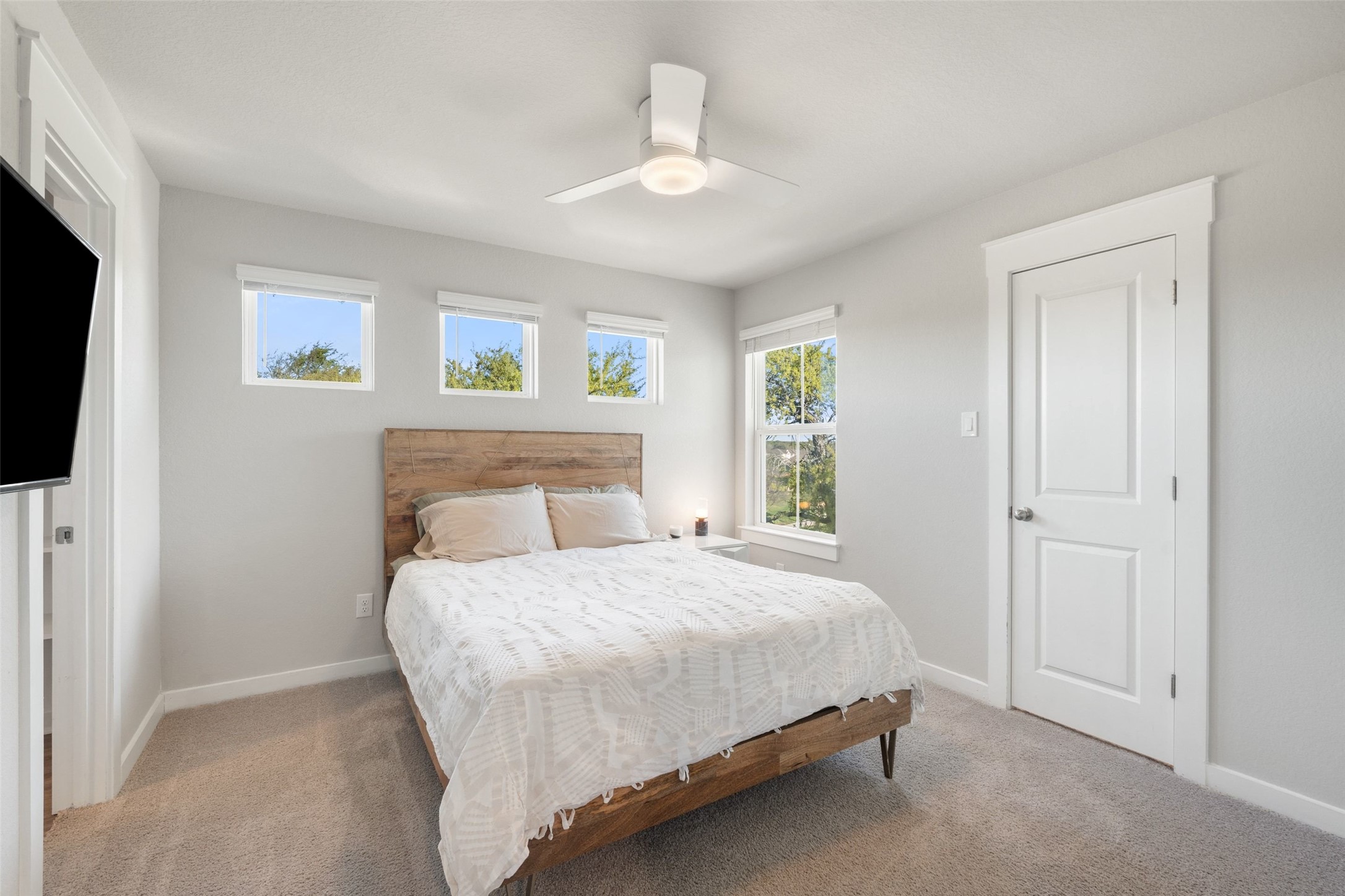 2251 Rocoso Trail Leander, TX 78641 - Photo 16 of 24 a bedroom with a bed and a flat screen tv
