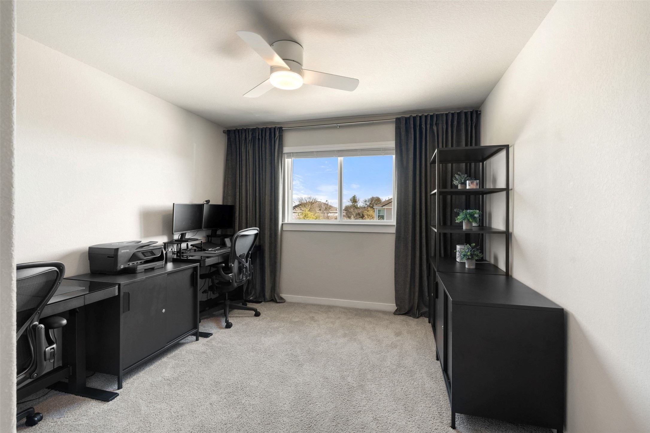 2251 Rocoso Trail Leander, TX 78641 - Photo 17 of 24 a kitchen with cabinets and a refrigerator