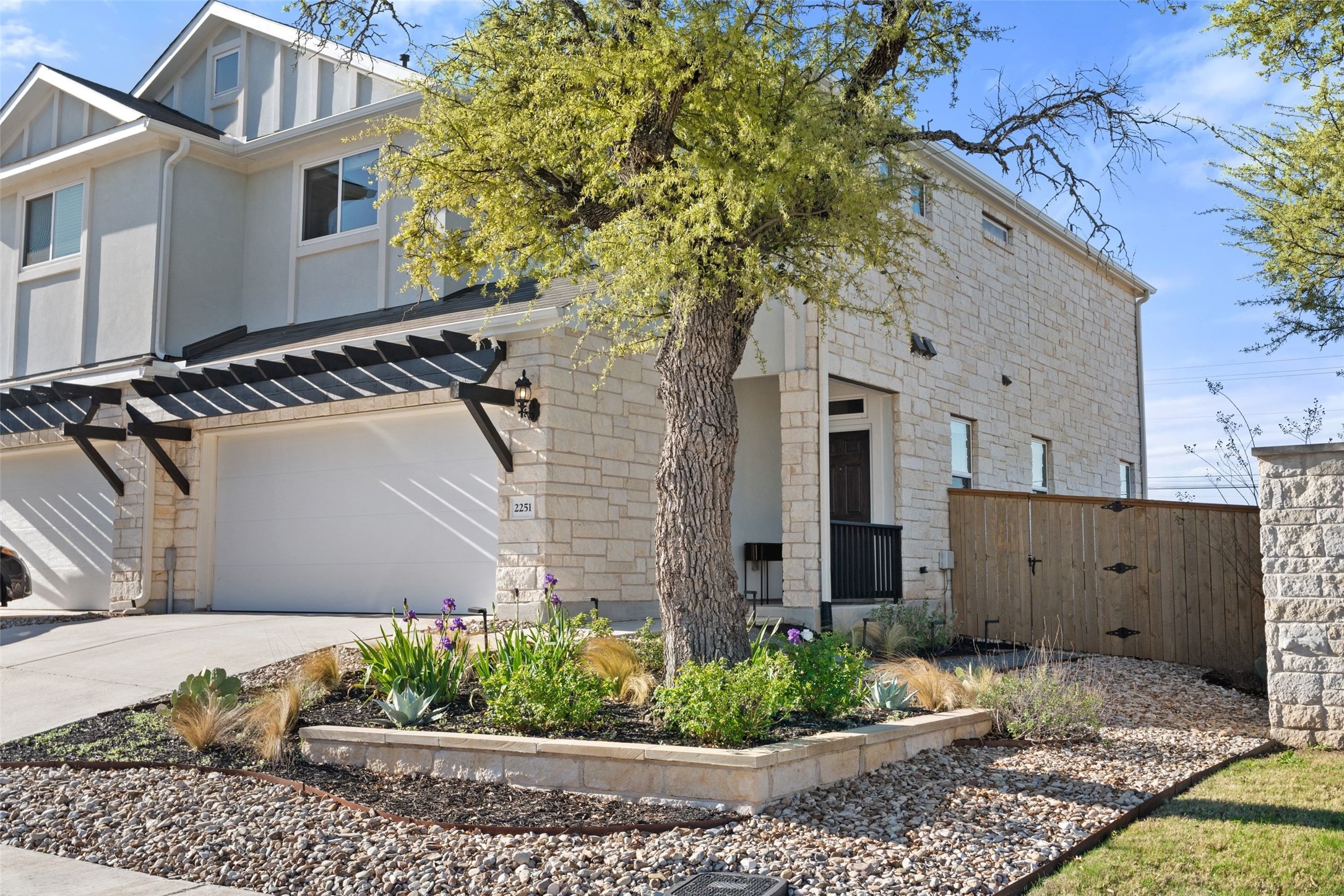 2251 Rocoso Trail Leander, TX 78641 - Photo 24 of 24 a front view of a house with a garden