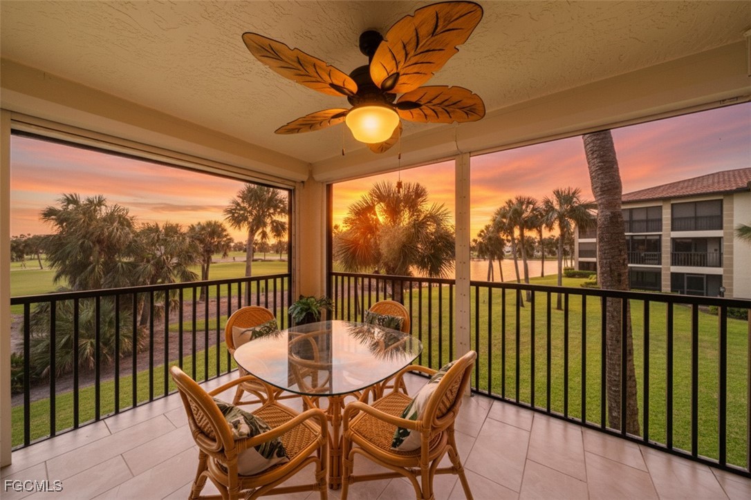 a view of a chairs and table in the balcony