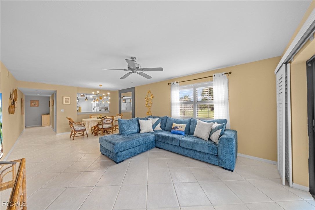 12581 Kelly Sands Way, Unit 518 Fort Myers, FL 33908 - Photo 11 of 33 a living room with furniture and a large window