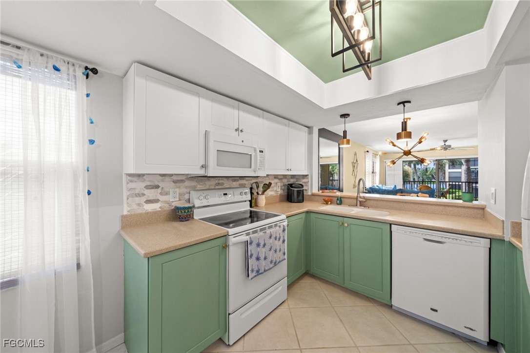 12581 Kelly Sands Way, Unit 518 Fort Myers, FL 33908 - Photo 12 of 33 a kitchen with a sink and cabinets