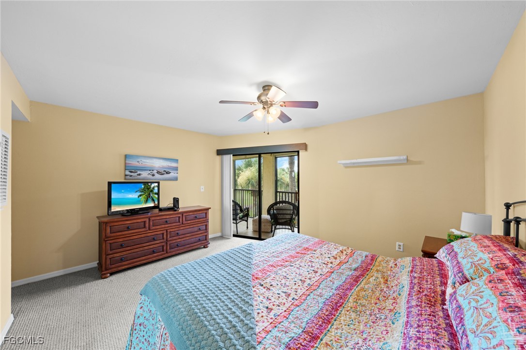 12581 Kelly Sands Way, Unit 518 Fort Myers, FL 33908 - Photo 22 of 33 a bedroom with a bed and a dresser next to a window