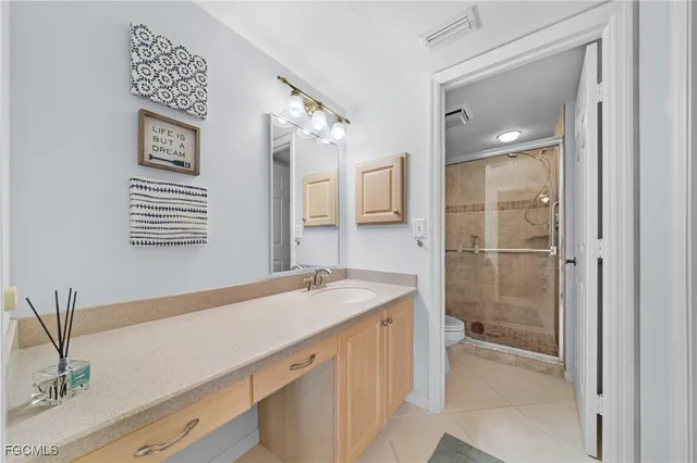 a bathroom with a sink a vanity and a mirror