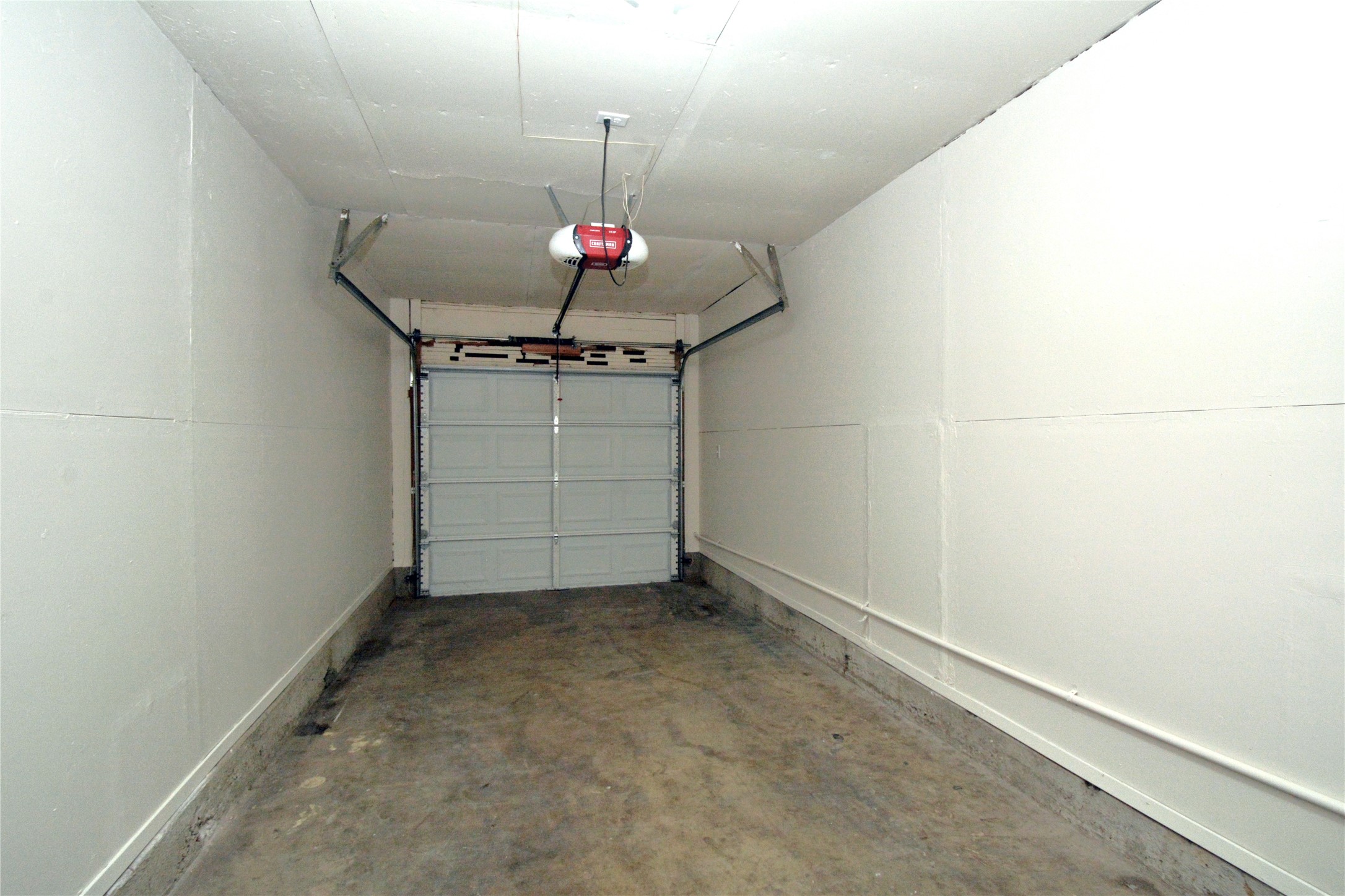 11314 Walnut Ridge Drive, Unit B Austin, TX 78753 - Photo 12 of 19 Secure parking and extra storage space await in this convenient single-car garage.
