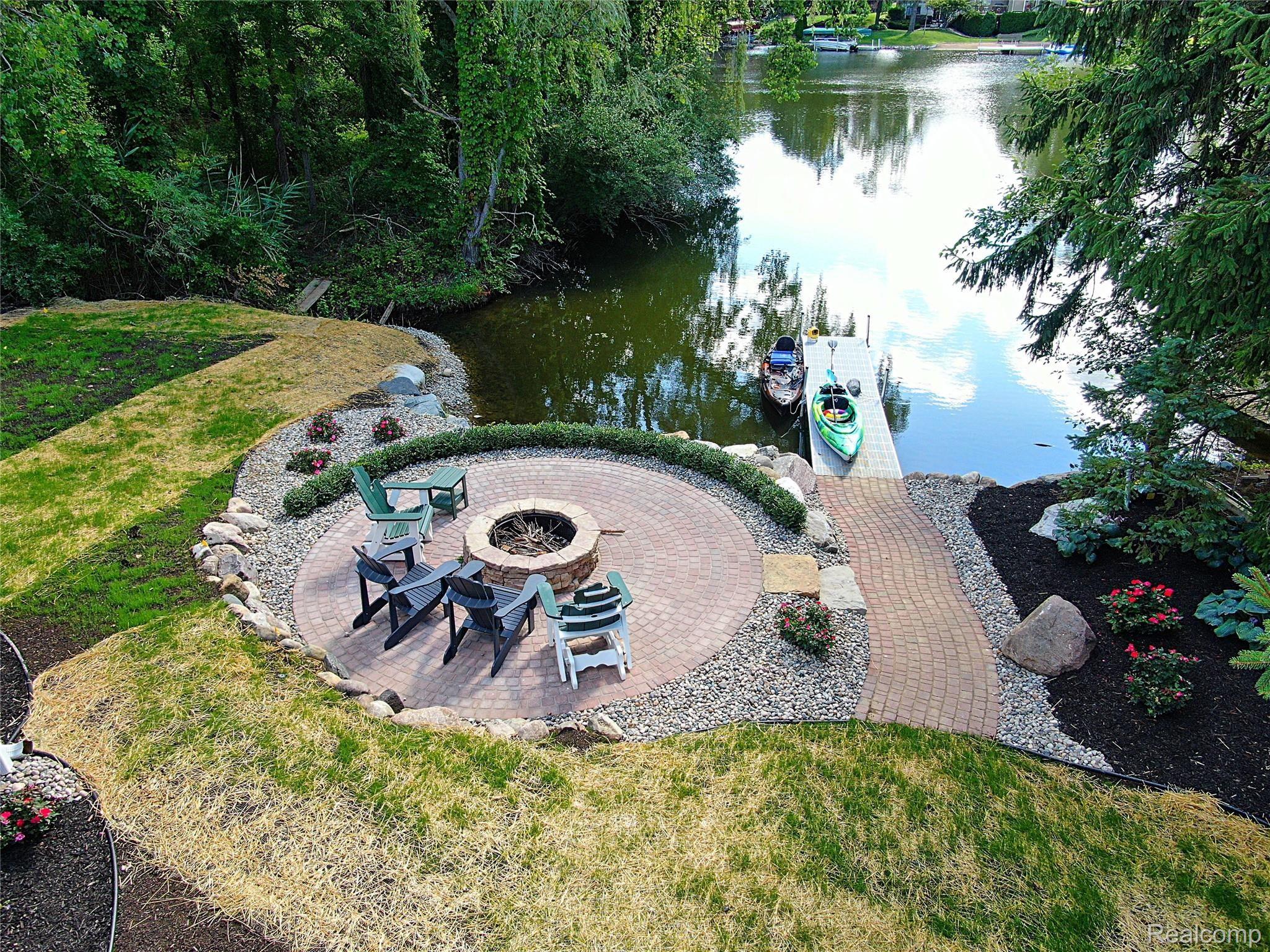 3175 East Commerce Road Commerce Township, MI 48382 - Photo 3 of 31 Fire pit overlooking Lake Sherwood