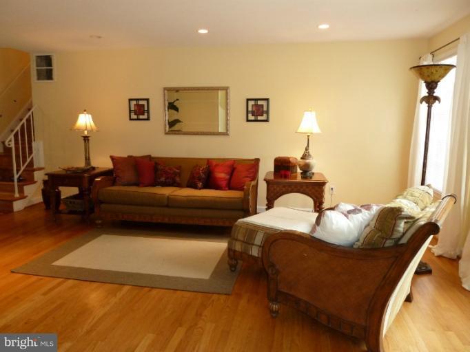 14424 Cantrell Road Silver Spring, MD 20905 - Photo 16 of 18 a bedroom with a bed and a couch