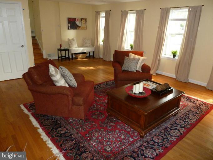 14424 Cantrell Road Silver Spring, MD 20905 - Photo 3 of 18 a living room with furniture and a couch