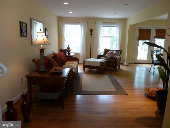 14424 Cantrell Road Silver Spring, MD 20905 - Photo 4 of 18 a living room with furniture and wooden floor
