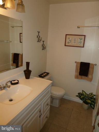 14424 Cantrell Road Silver Spring, MD 20905 - Photo 8 of 18 a bathroom with a sink and a toilet