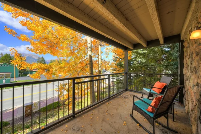 a view of a two chairs in the balcony