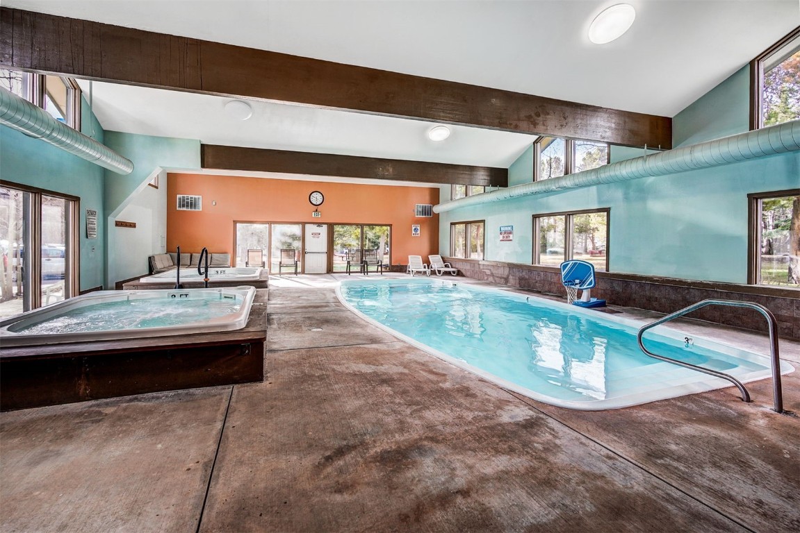 112 La Bonte Street, Unit 208 Dillon, CO 80435 - Photo 20 of 25 a living room with kitchen island granite countertop furniture and a fireplace