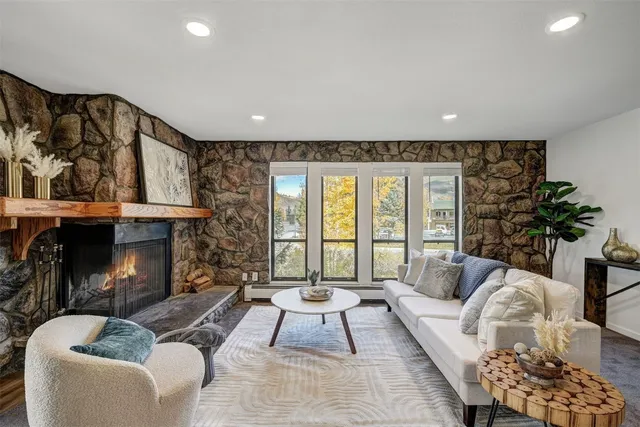 a living room with furniture and a fireplace