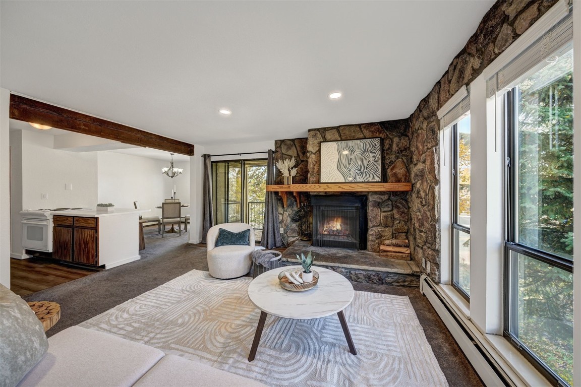 112 La Bonte Street, Unit 208 Dillon, CO 80435 - Photo 3 of 25 a living room with furniture and a fireplace