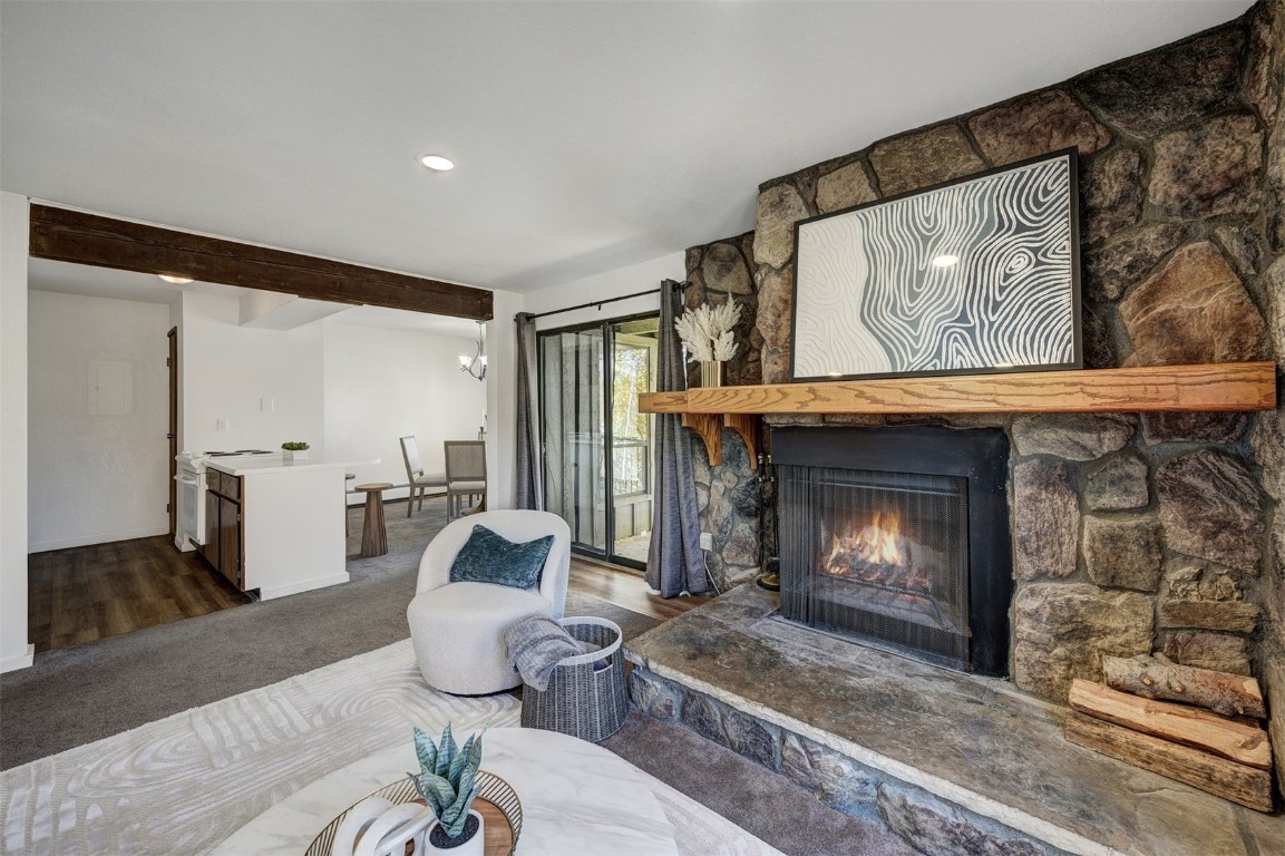 112 La Bonte Street, Unit 208 Dillon, CO 80435 - Photo 4 of 25 a living room with furniture and a fireplace