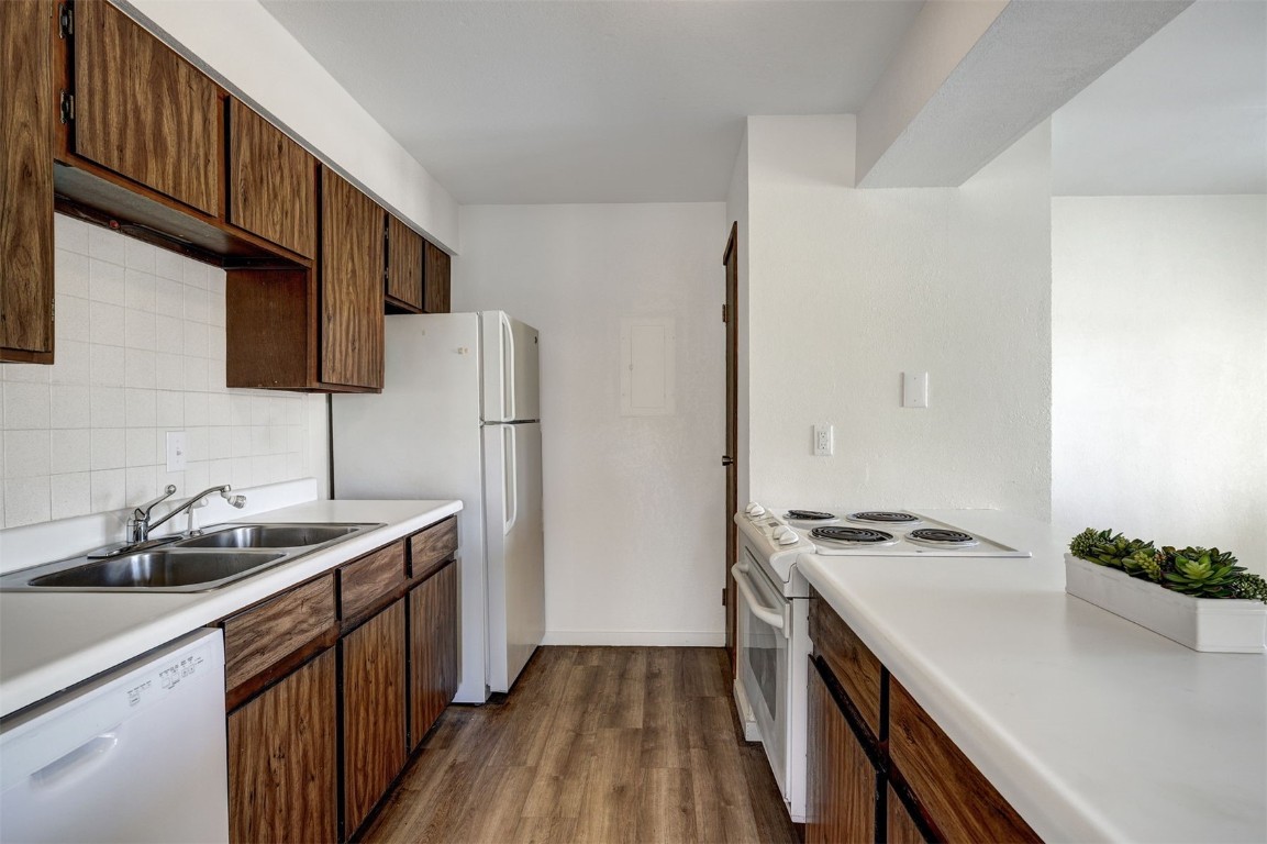 112 La Bonte Street, Unit 208 Dillon, CO 80435 - Photo 6 of 25 a kitchen with stainless steel appliances granite countertop a sink stove and refrigerator