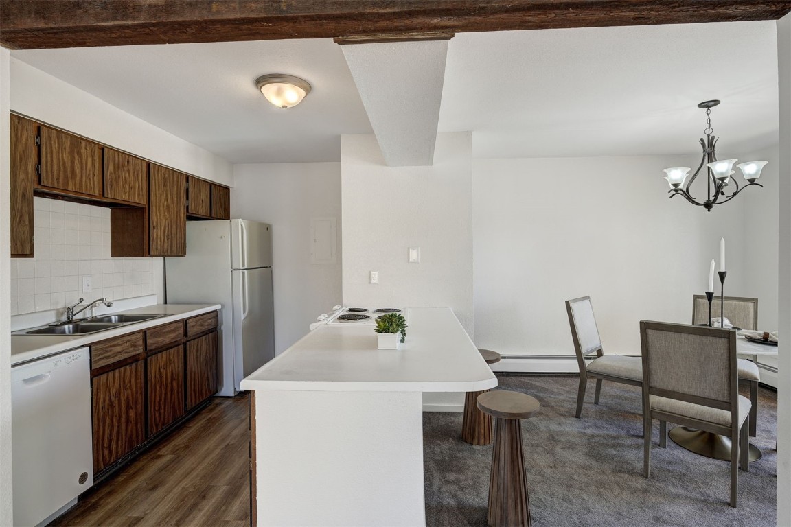 112 La Bonte Street, Unit 208 Dillon, CO 80435 - Photo 8 of 25 a kitchen with sink cabinets and stainless steel appliances