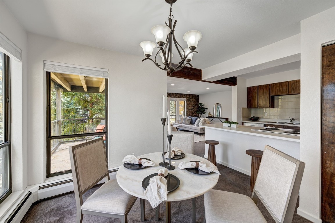 112 La Bonte Street, Unit 208 Dillon, CO 80435 - Photo 10 of 25 a view of a dining room with furniture window and wooden floor
