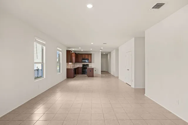 a big room with closet and windows