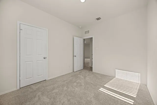 a bathroom with a granite countertop toilet a sink and a bathtub
