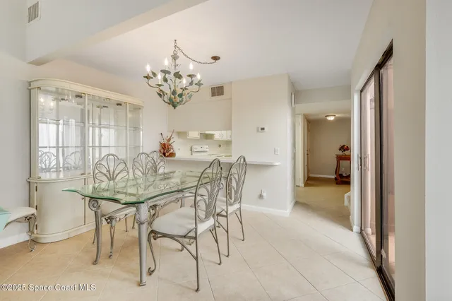 a kitchen with a table and chairs