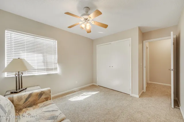 a bathroom with a granite countertop sink and a mirror with toilet