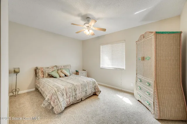 a view of a storage & utility room with dryer and washer