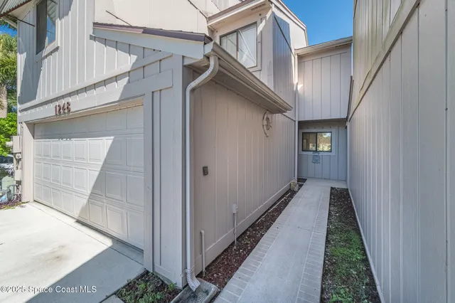 a view of a house with a street