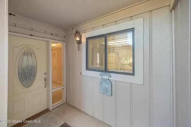 a front view of a house with washer and dryer