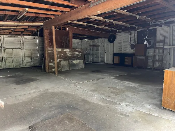 a view of empty room with wooden ceiling