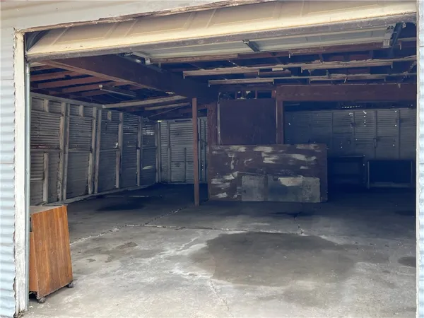 a view of water heater room with a fireplace