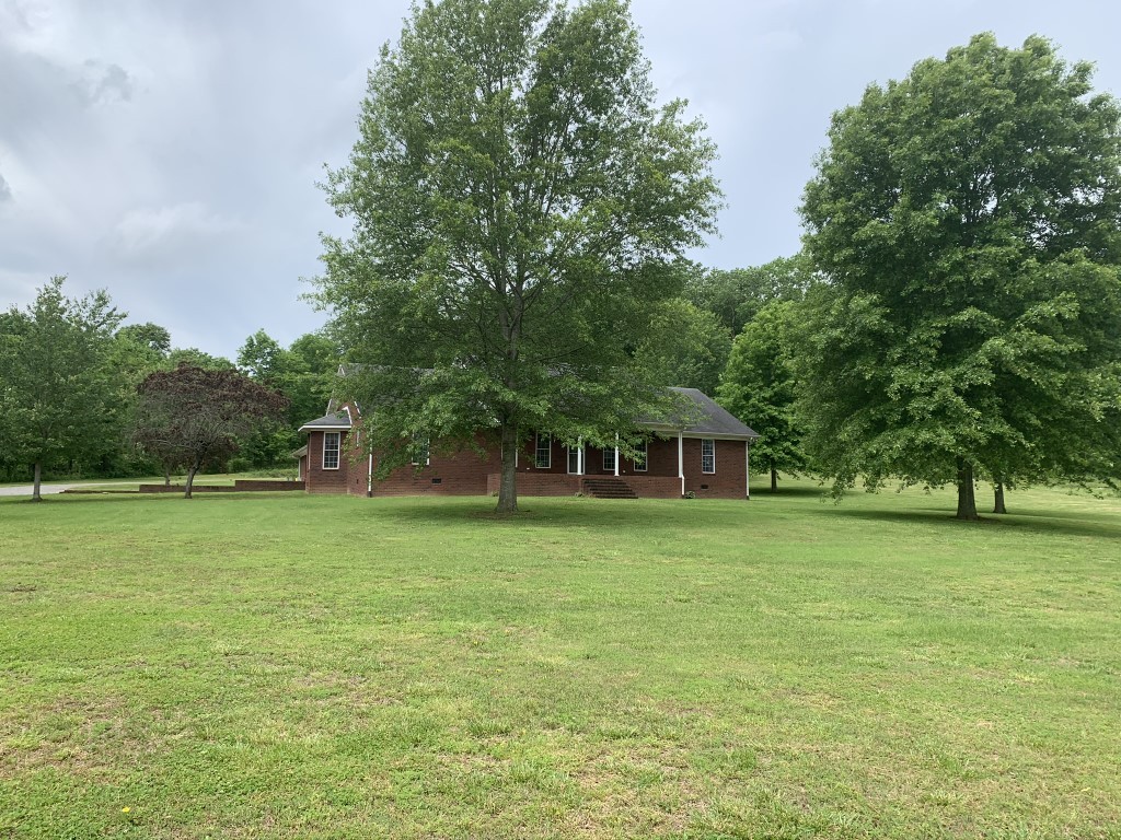 579 Rocky Road Liberty, TN 37095 - Photo 2 of 44 a front view of a house with a yard